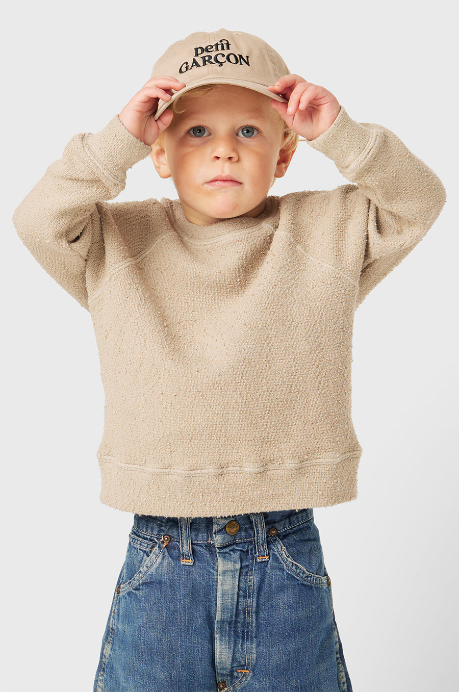 Model wearing Petit Garçon Baseball Cap in Khaki/Black little lady & petit sailor