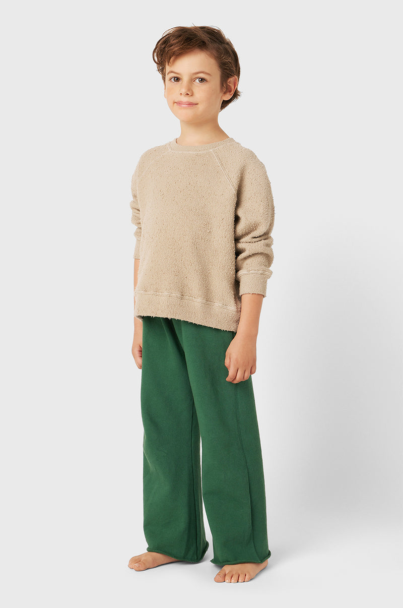 Model wearing Kids French Flare Pant in Pine Organic Cotton little lady & petit sailor