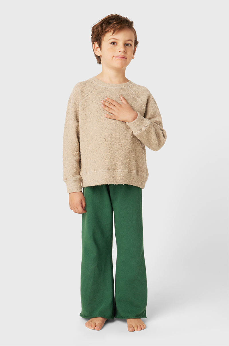 Model wearing Kids French Flare Pant in Pine Organic Cotton little lady & petit sailor