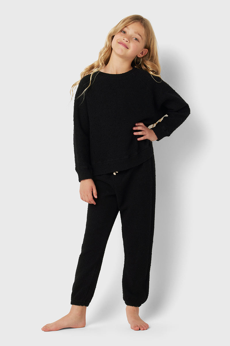 Model wearing Kids Vintage Sweatpants in Black Bouclé little lady & petit sailor