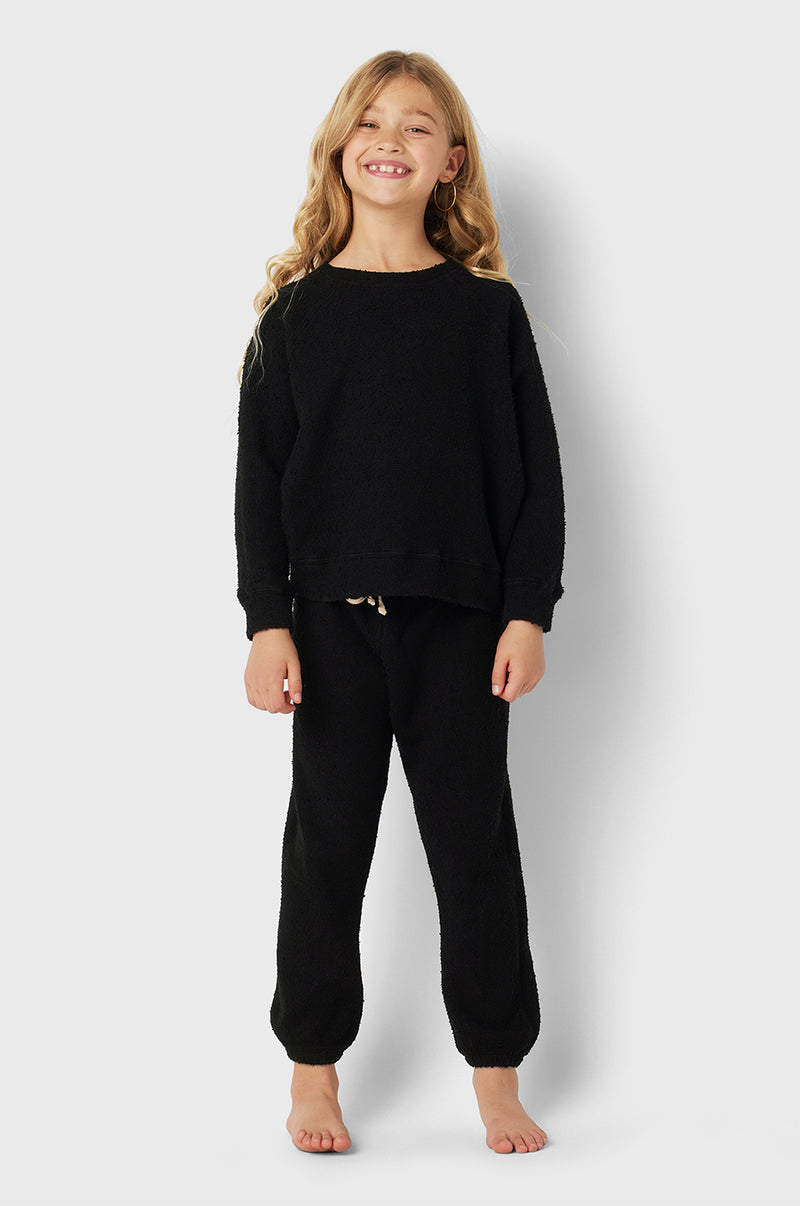 Model wearing Kids Vintage Sweatpants in Black Bouclé little lady & petit sailor