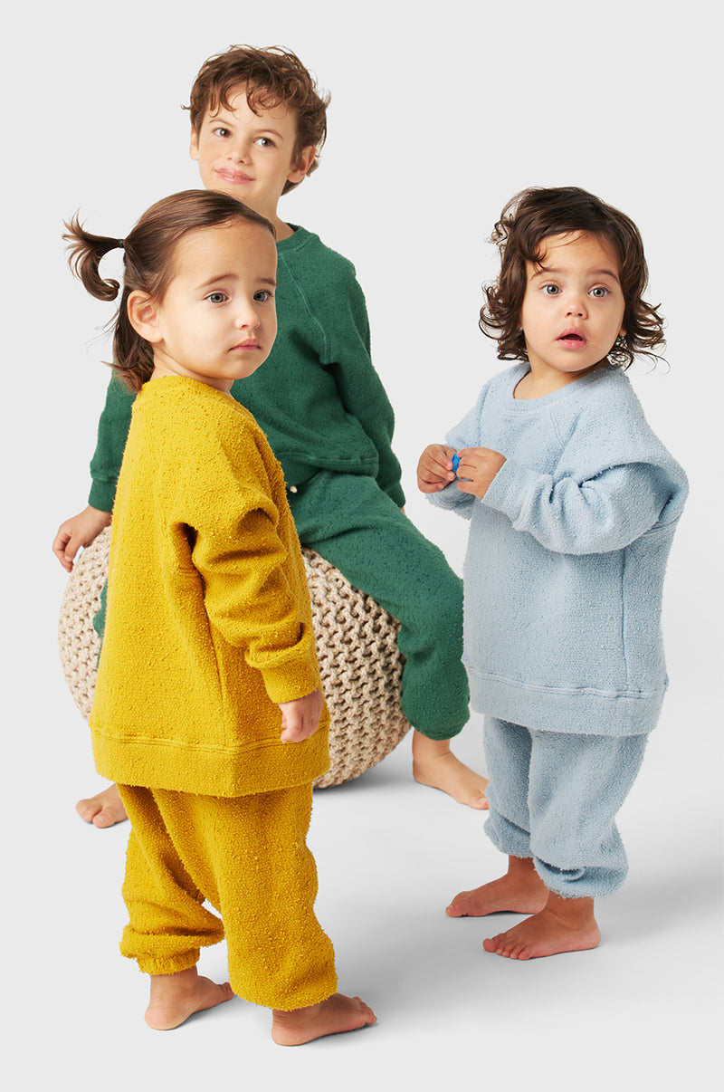 Model wearing Kids Vintage Sweatpants in Pine Bouclé little lady & petit sailor