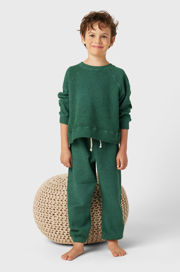 Model wearing Kids Vintage Sweatpants in Pine Bouclé little lady & petit sailor