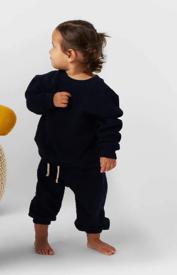 Model wearing Kids Vintage Sweatpants in Navy Bouclé little lady & petit sailor