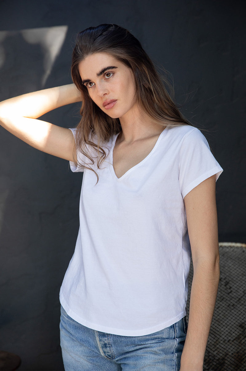 Brunette model wearing the lady & the sailor V Neck Tee in White Organic Cotton Jersey.