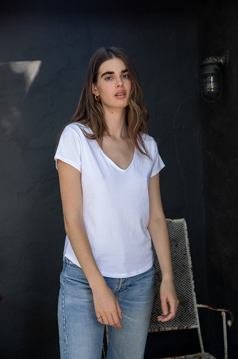 Brunette model wearing the lady & the sailor V Neck Tee in White Organic Cotton Jersey.