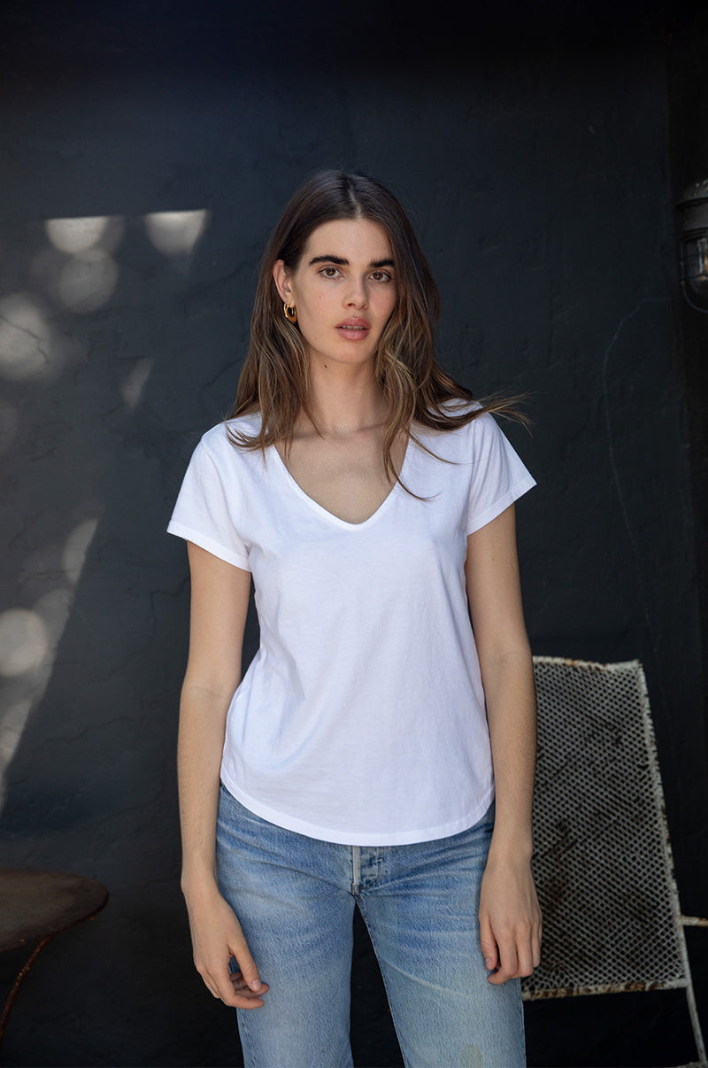 Brunette model wearing the lady & the sailor V Neck Tee in White Organic Cotton Jersey.