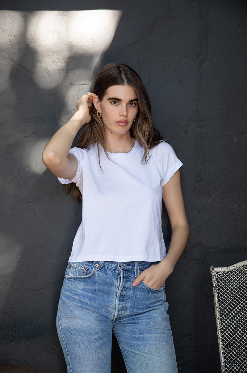 Brunette Model wearing the lady & the sailor Shrunken BF Tee in White Luxe Cotton.