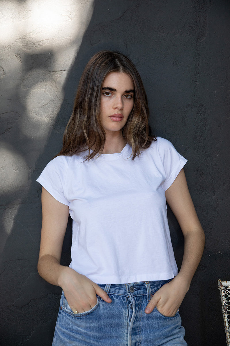 Brunette Model wearing the lady & the sailor Shrunken BF Tee in White Luxe Cotton.