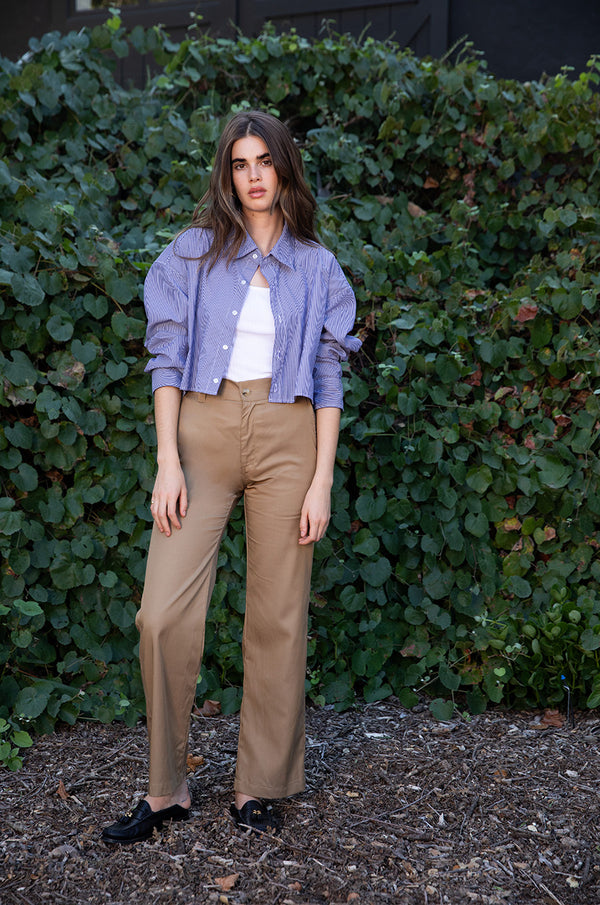Brunette model wearing the lady & the sailor Relaxed Trouser in Camel.
