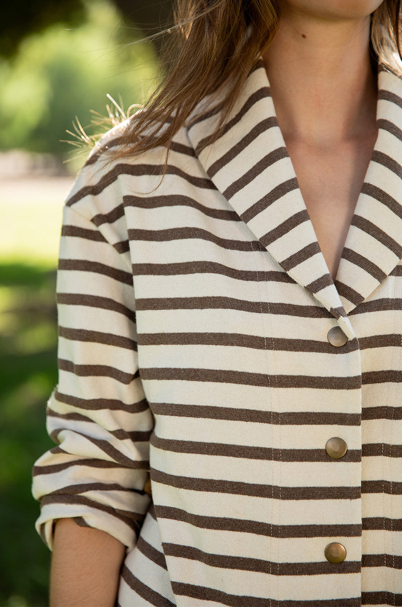 Brunette model wearing the lady and the sailor Snap Cardi in Mocha Stripe.