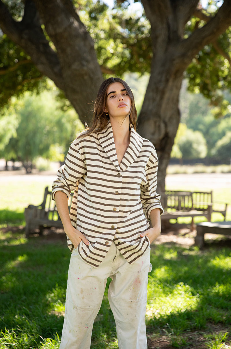 Brunette model wearing the lady and the sailor Snap Cardi in Mocha Stripe.