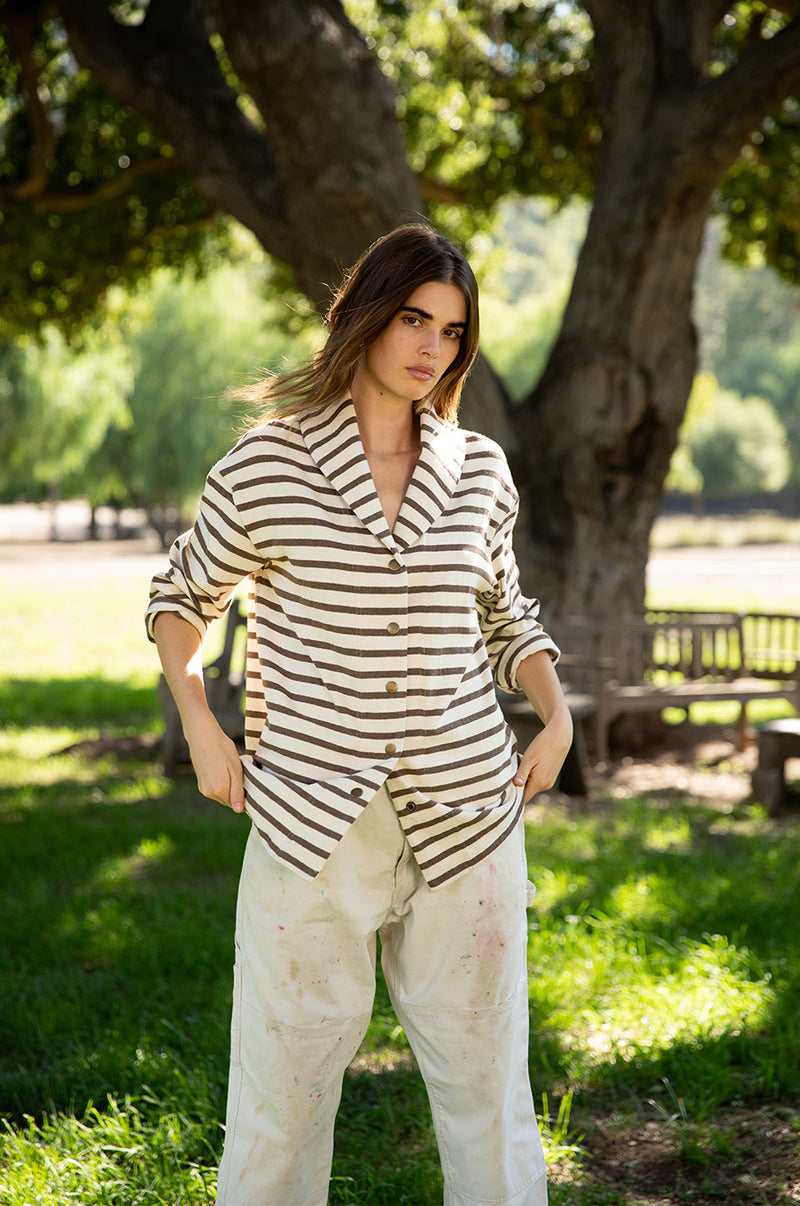 Brunette model wearing the lady and the sailor Snap Cardi in Mocha Stripe.