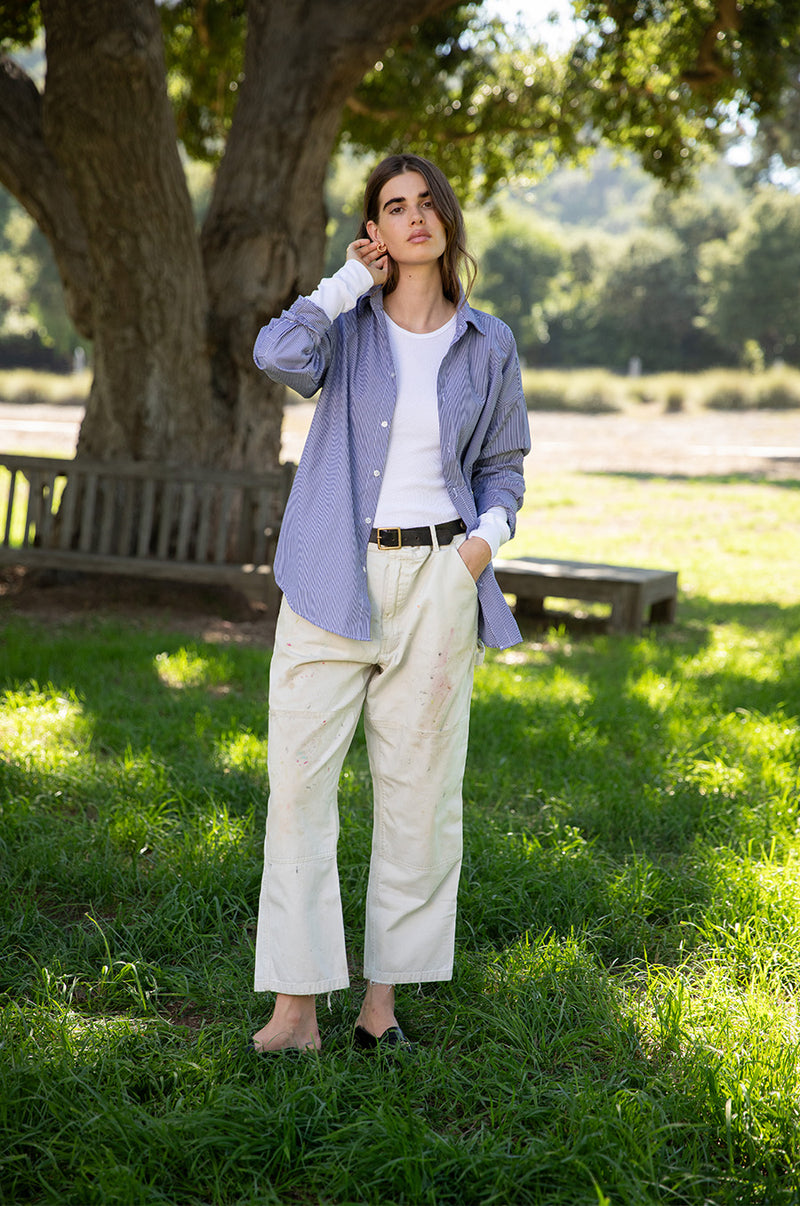 Brunette model wearing the lady & the sailor The Sunday Shirt in Navy Pinstripe.