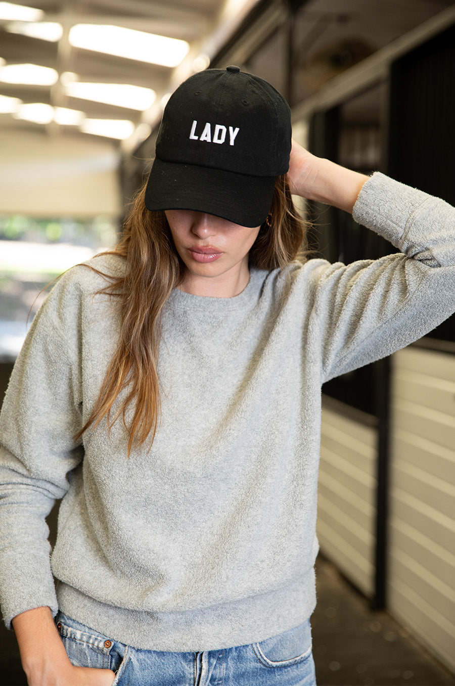 Brunette model wearing the lady & the sailor Lady Baseball Cap in Black and White.