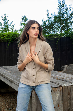 Brunette model wearing the lady and the sailor Pocket Cardi in Stone Bouclé.