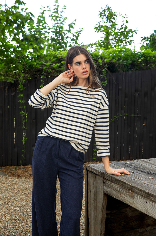 Brunette model wearing the lady & the sailor Boxy Pullover in Navy Stripe.