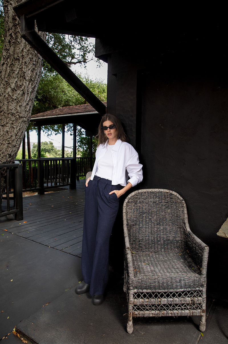 Brunette model wearing the lady & the sailor Cropped Button Up in White Poplin.