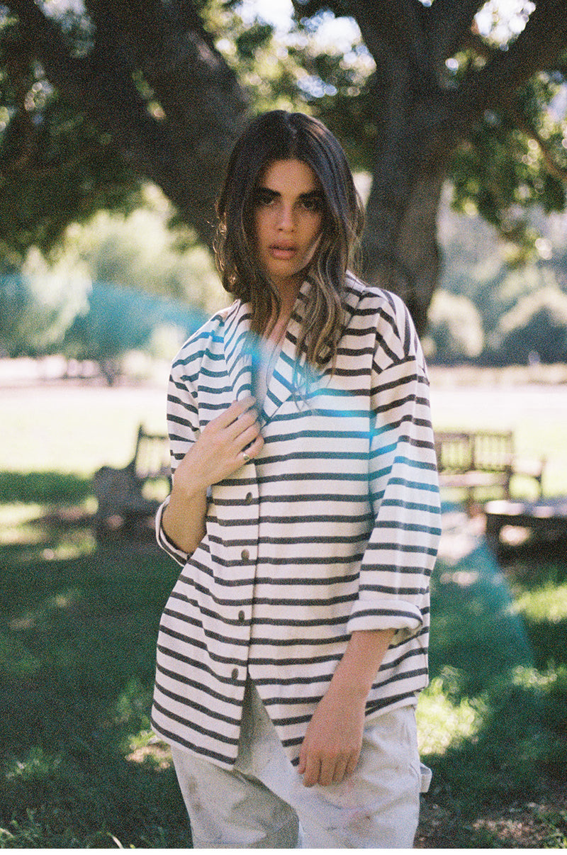 Brunette model wearing the lady and the sailor Snap Cardi in Mocha Stripe.