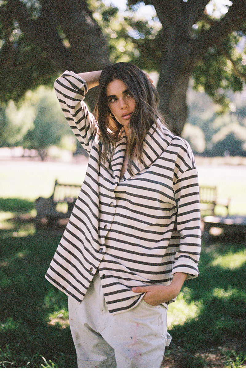 Brunette model wearing the lady and the sailor Snap Cardi in Mocha Stripe.