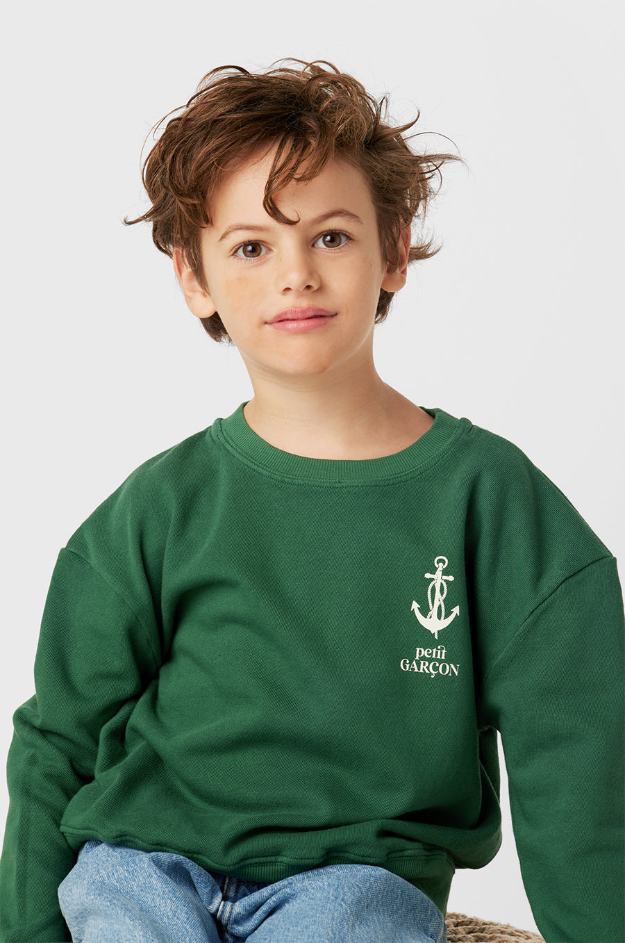 Model wearing Kids Petit Garçon Varsity Crewneck in Pine Organic Cotton little lady & petit sailor 
