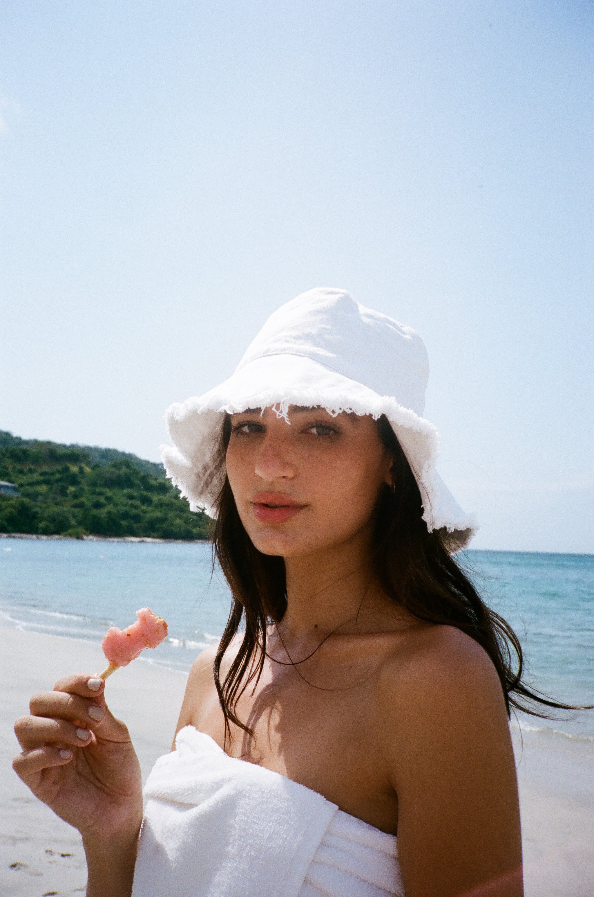 Model wearing the lady and the sailor Lady Bucket Hat in white and black.