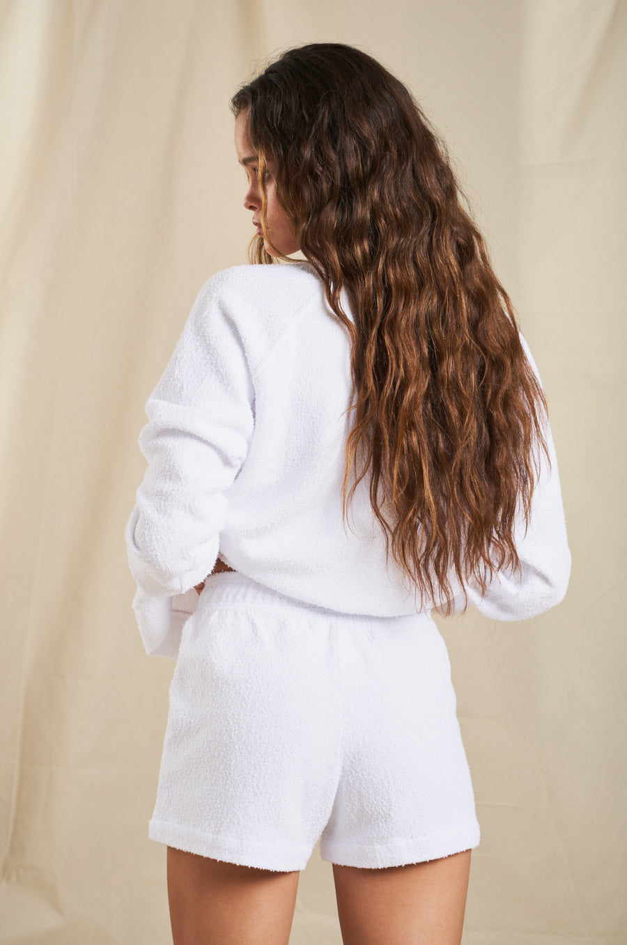 Model wearing the lady & the sailor Weekend Shorts in White Boucle 