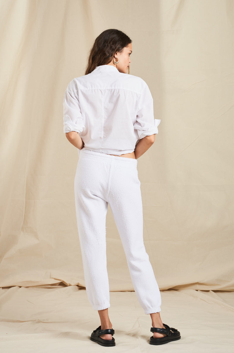 Model wearing the lady & the sailor Vintage Sweatpant in White Boucle