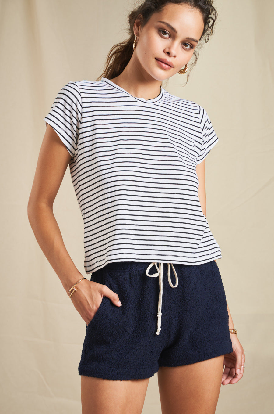 Modeling wearing the lady & the sailor Weekend Short in Navy Boucle.