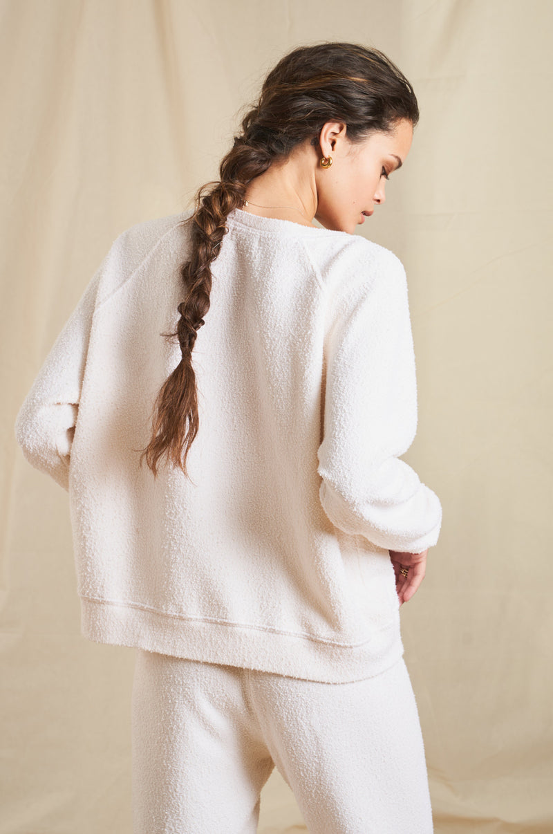 Model wearing the lady & the sailor Brentwood Sweatshirt in Vanilla Boucle 