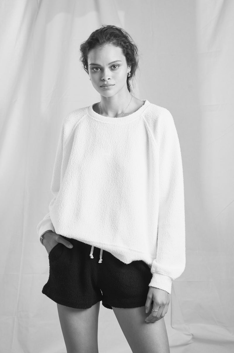 Model wearing the lady & the sailor Weekend Short in Black Boucle.