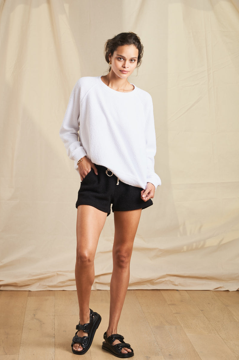 Model wearing the lady & the sailor Weekend Short in Black Boucle.