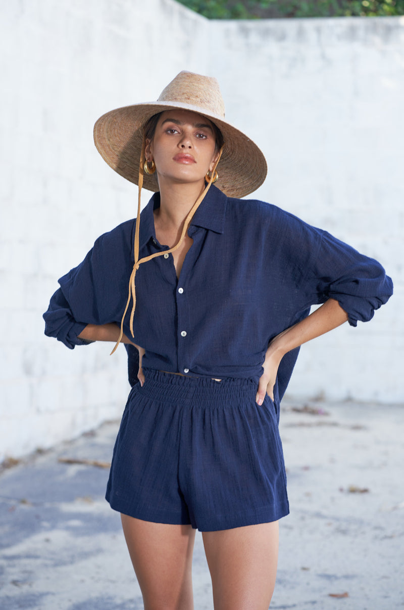 Brunette Model wearing the lady & the sailor Sunday Shirt in Navy Gauze.