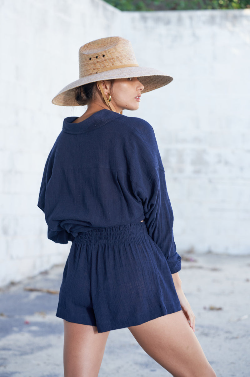 Brunette Model wearing the lady & the sailor Sunday Shirt in Navy Gauze.