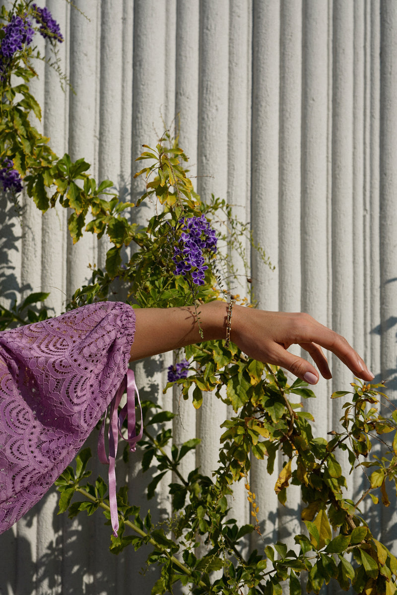 Model wearing Billow Sleeve Tunic Mini Dress in Lavender Lace.