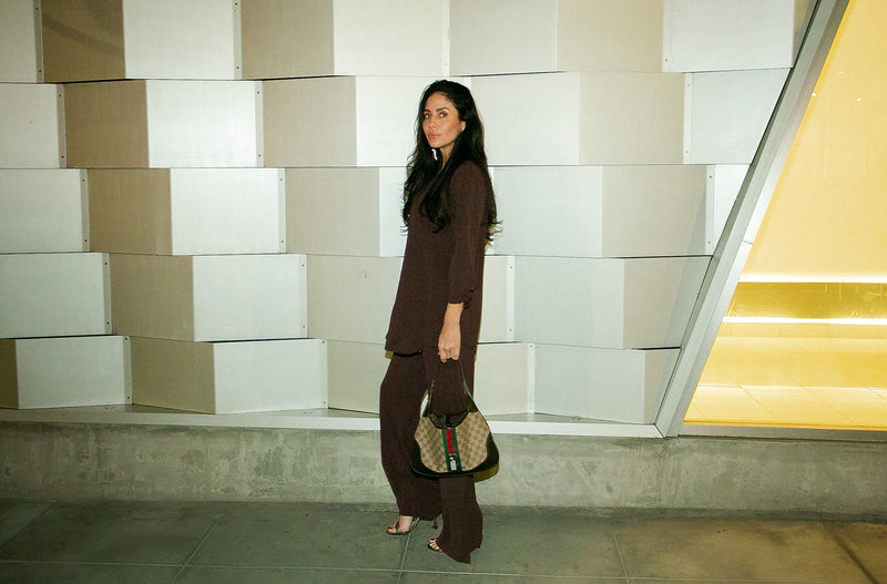 Brunette Model wearing the lady & the sailor Smock Band Pants in Chocolate Air Flow.