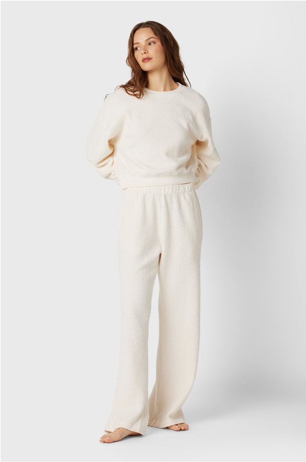 Brunette Model wearing the lady & the sailor Straight Leg Sweatpant in Vanilla Bouclé.