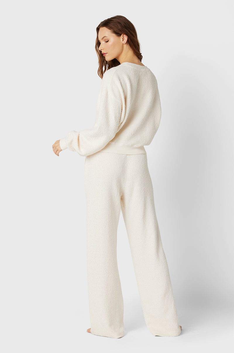 Brunette Model wearing the lady & the sailor Straight Leg Sweatpant in Vanilla Bouclé.