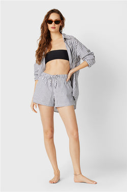 Brunette Model wearing the lady & the sailor Flutter Short in Navy Stripe Poplin.
