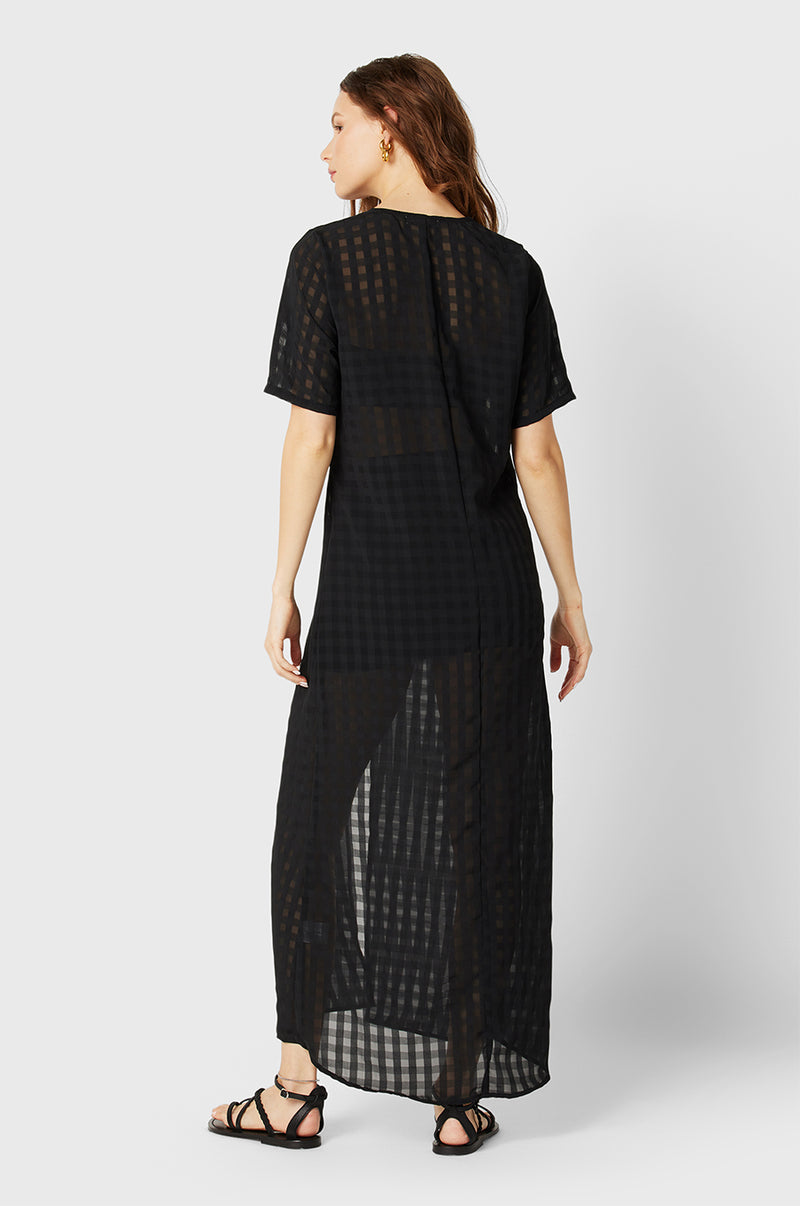 Model wearing the lady & the sailor Georgie Dress in Black Gingham.