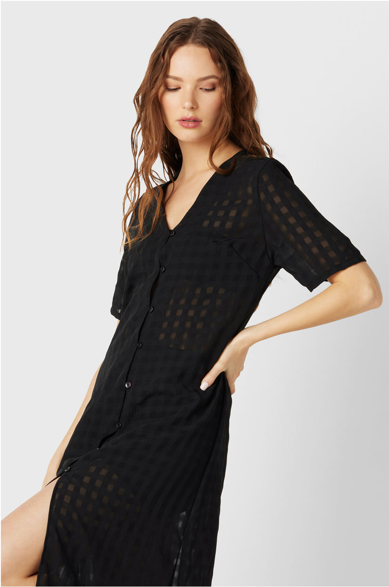 Model wearing the lady & the sailor Georgie Dress in Black Gingham.