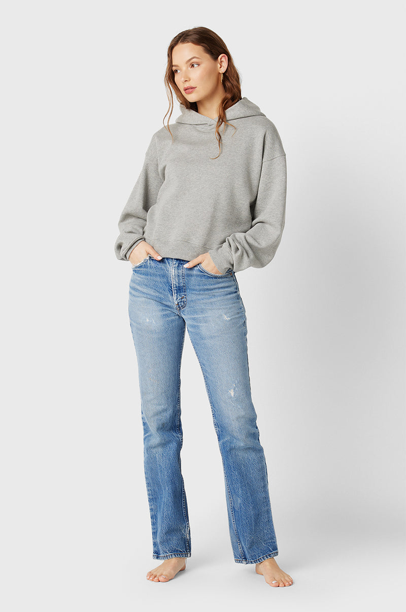 Model wearing the lady & the sailor the Hoodie in Heather Grey Fleece.