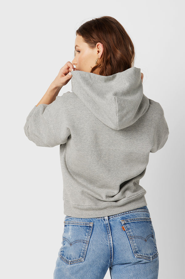 Model wearing the lady & the sailor the Hoodie in Heather Grey Fleece.