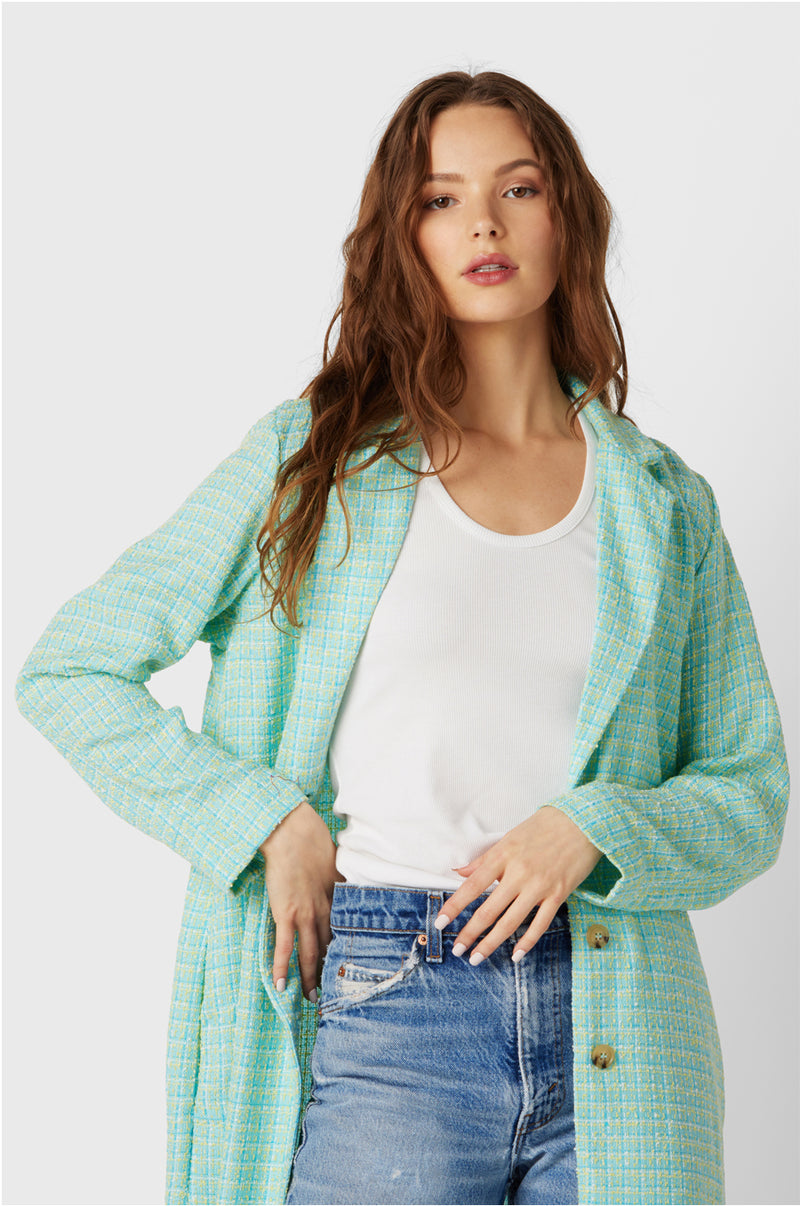 Brunette Model wearing the lady & the sailor Midi Blazer in Aqua Tweed.