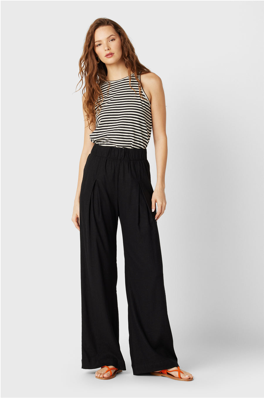 Brunette Model wearing the lady & the sailor the Bare Tank in Charcoal/Natural Stripe Organic Cotton.