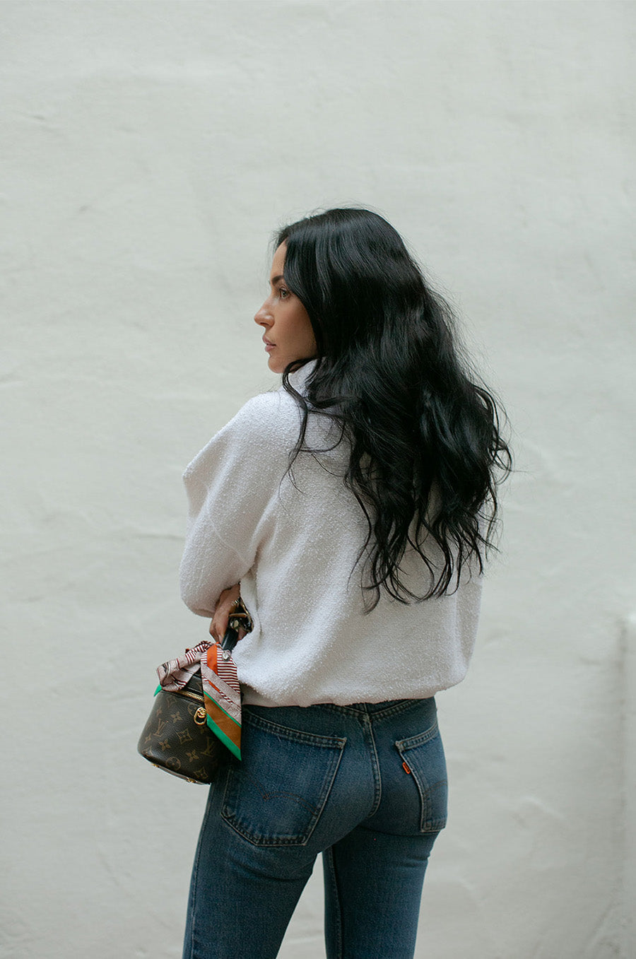Brunette Model wearing the lady & the sailor Polo Sweatshirt in Vanilla Boulcé.