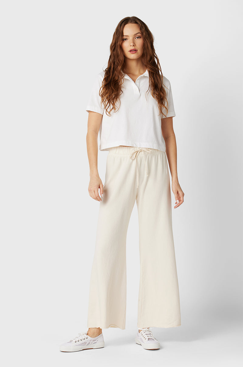 Model wearing the lady & the sailor French Flare Pant in Vanilla Organic Cotton.