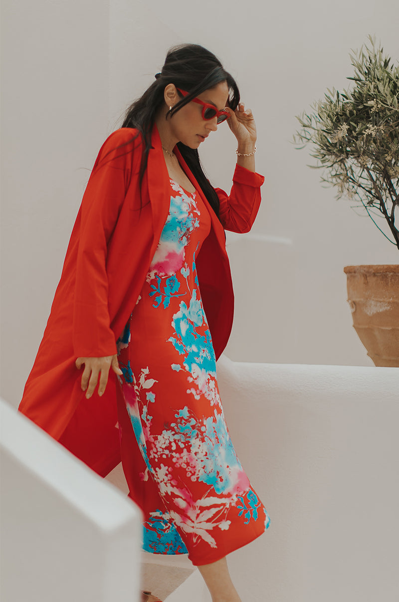 Brunette Model wearing the lady & the sailor The Duster in Geranium.