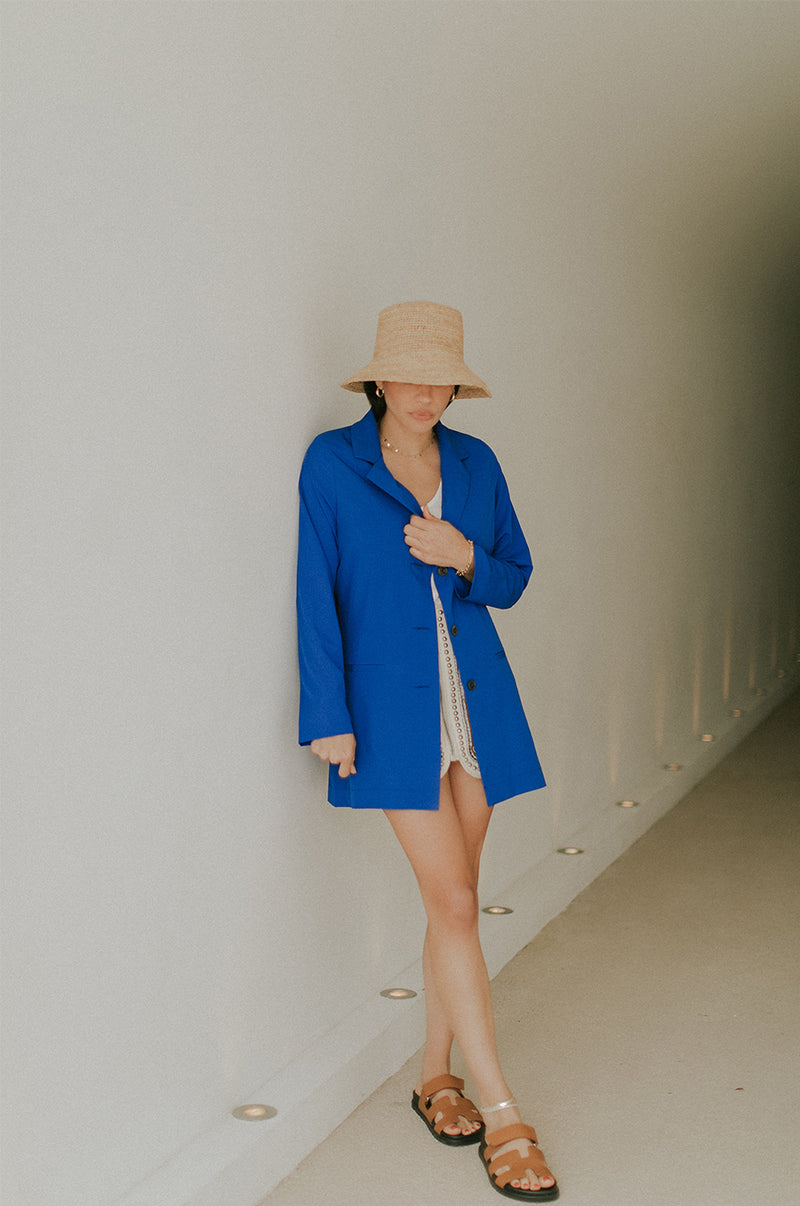 Brunette Model wearing the lady & the sailor Relaxed Blazer in Cobalt.