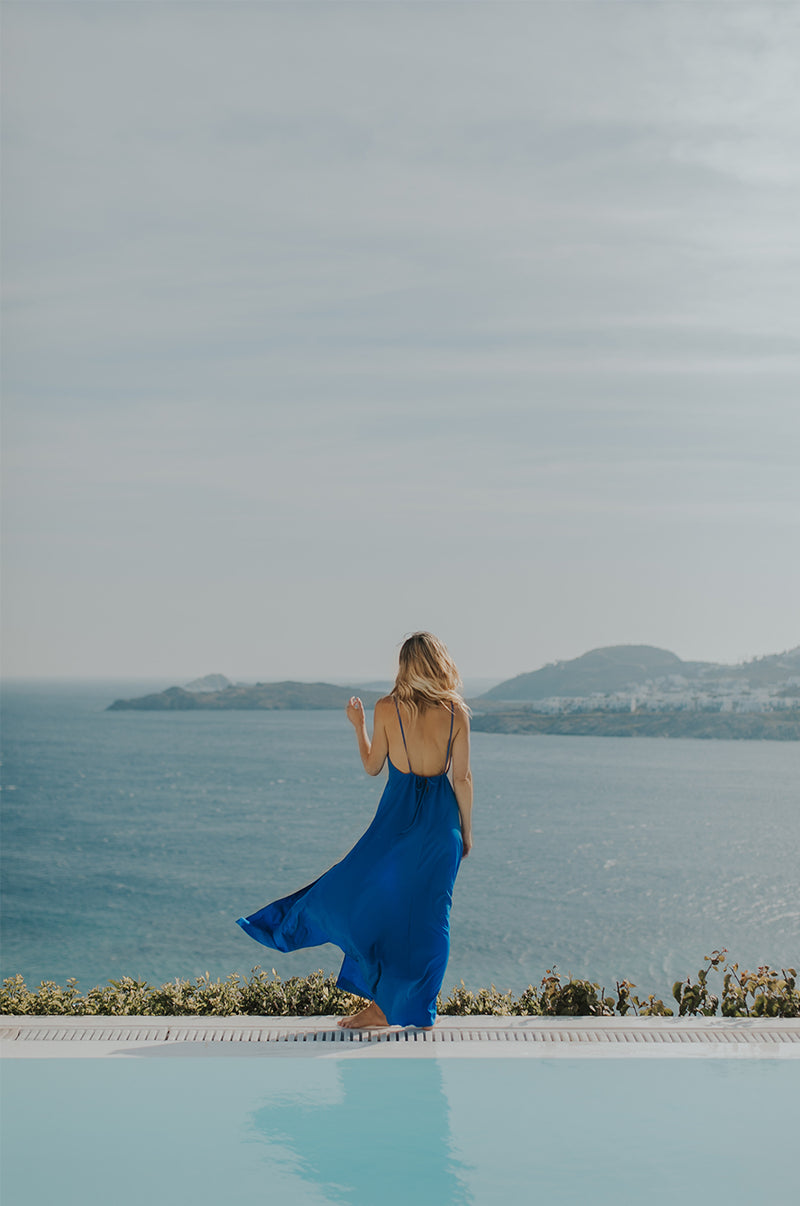 Blonde Model wearing the lady & the sailor Chloe Dress in Cobalt.